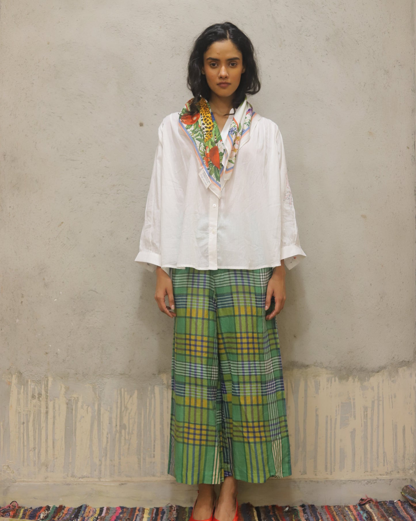 Cotton shirt with hand embroidered sleeve detail + printed check quilted reversible jacket + contrast check printed pants + matching bandana in cotton