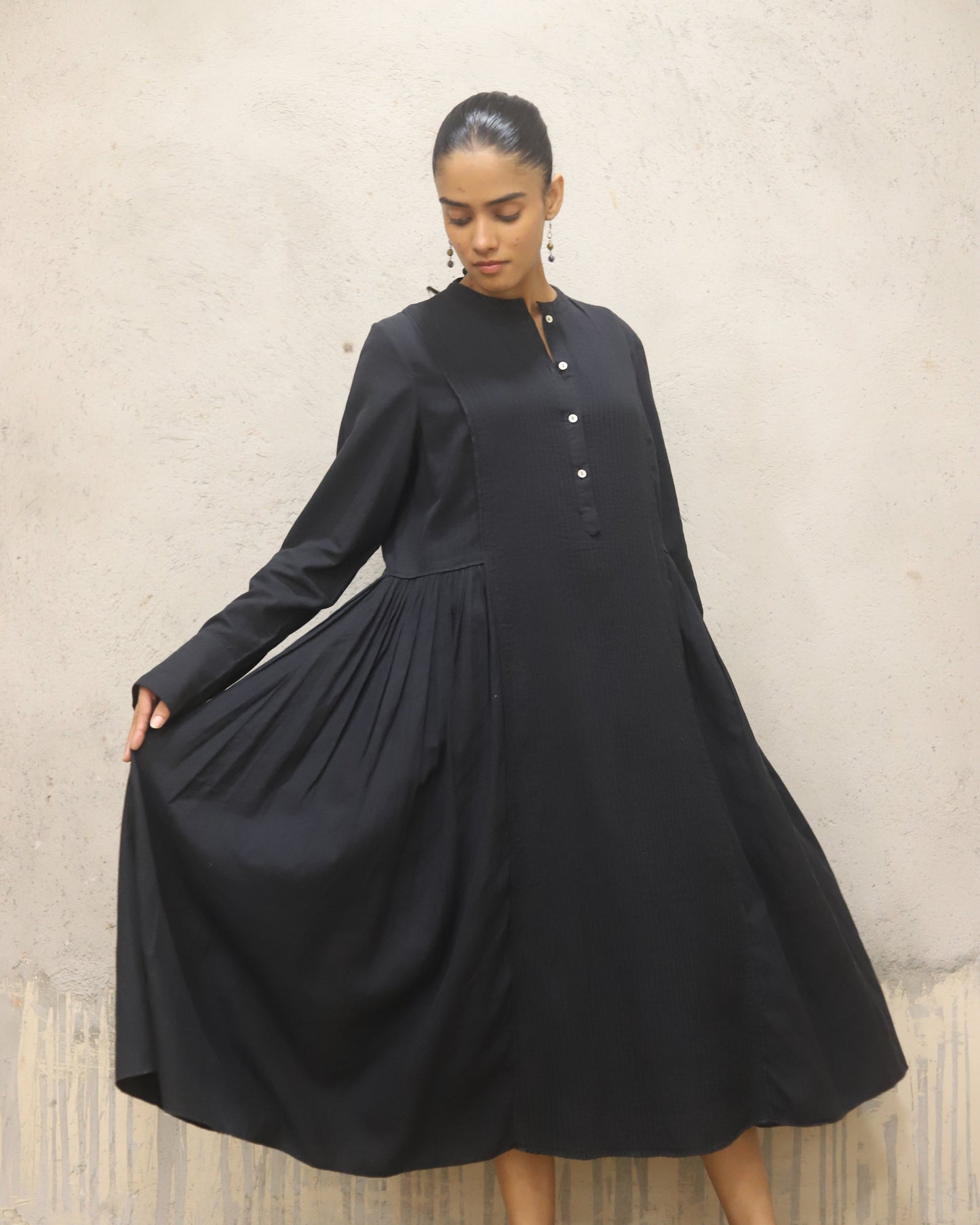 Pure cotton thick herringbone dress with heavy Pintuck detailing in the front and contrast mother of pearl buttons